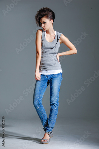 full-length girl in jeans, posing standing isolated posing