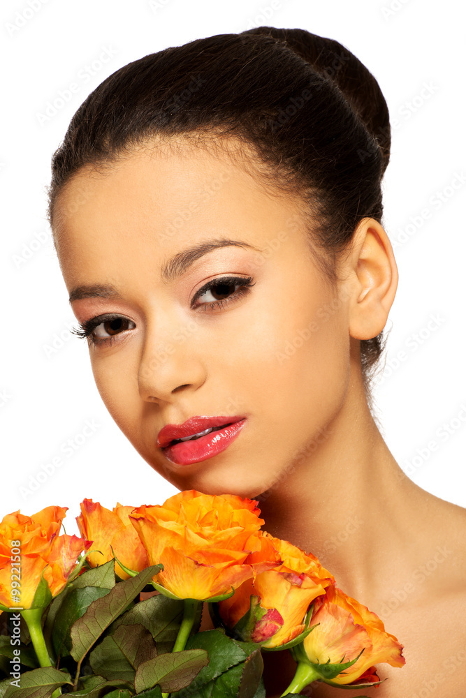 Fototapeta premium Beauty african woman with roses.