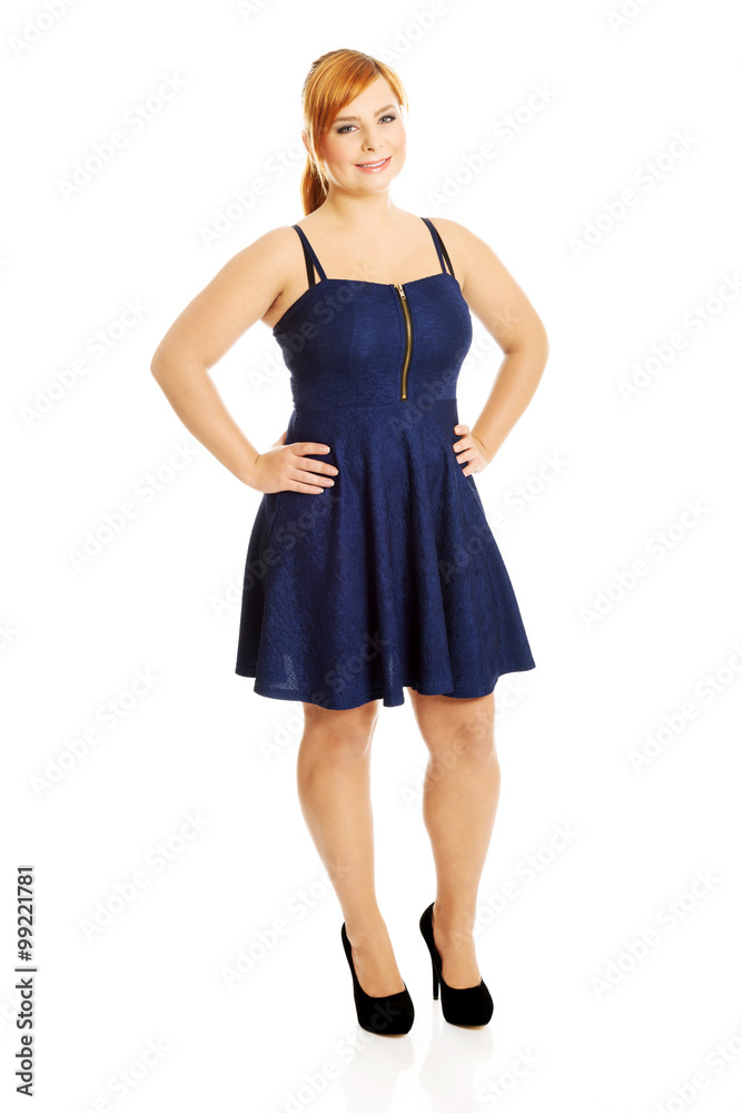 Plus size woman posing in skirt