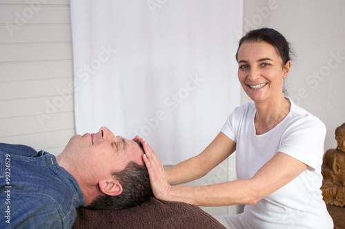 Therapist working with man in a medical office