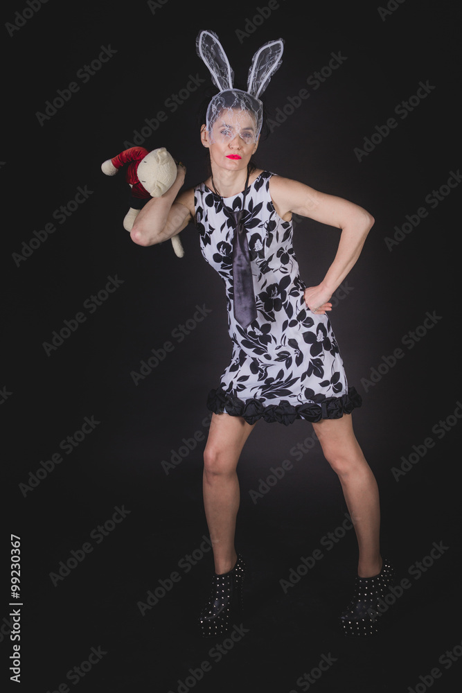 Femme au serre-tête lapin et sa peluche Stock Photo | Adobe Stock