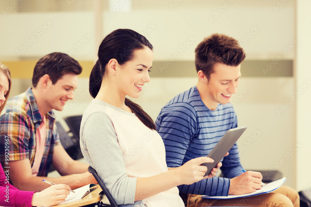 group of smiling students with tablet pc