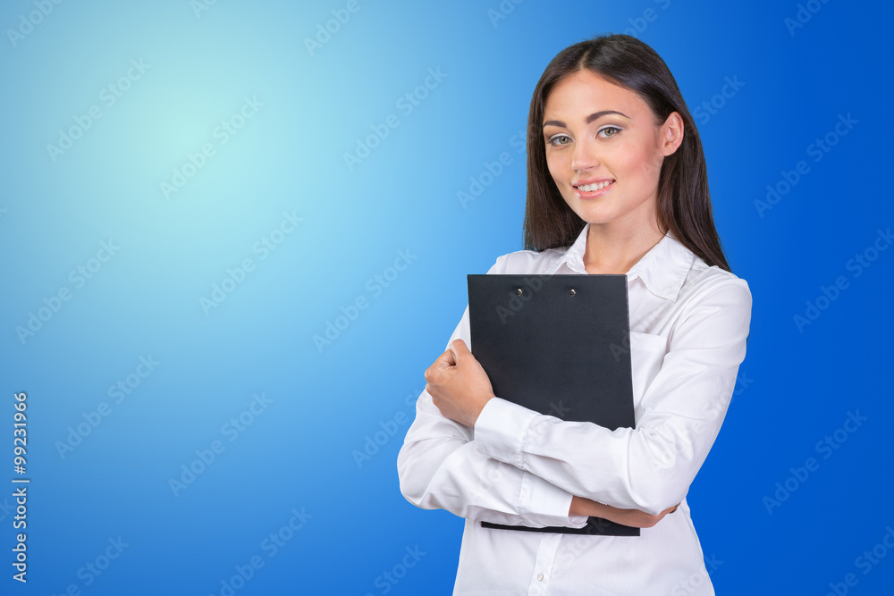 Young business woman standing with her clipboard Young business woman standing with her clipboard