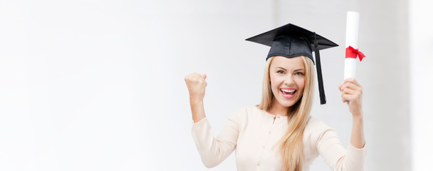 student in graduation cap with certificate