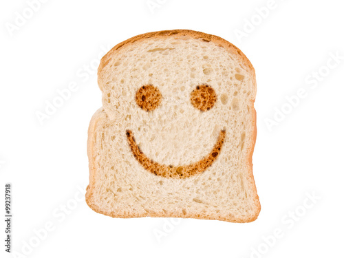 A smile toasted on a slice of bread, isolated on white background