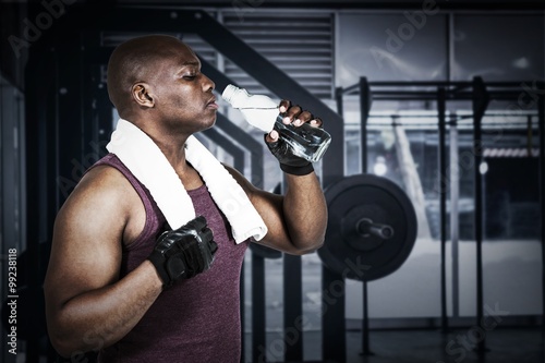 Composite image of fit man exercising with barbell 