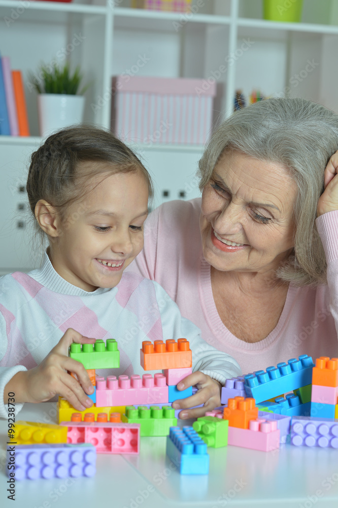Grandmother with granddaughter playing together Grandmother with granddaughter playing together