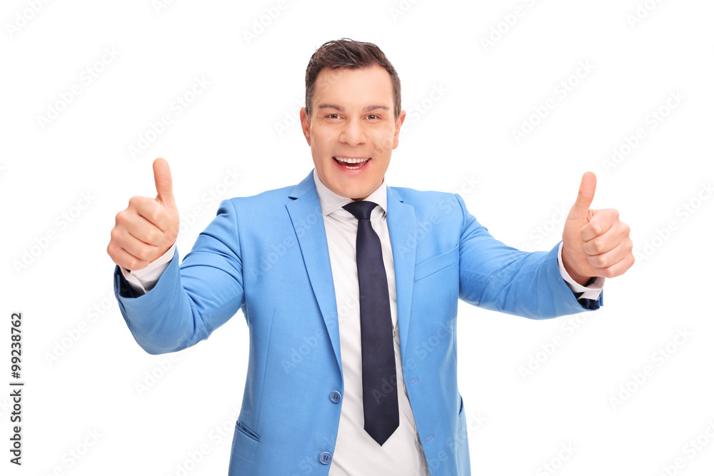 Man in a fancy blue suit giving two thumbs up Man in a fancy blue suit giving two thumbs up