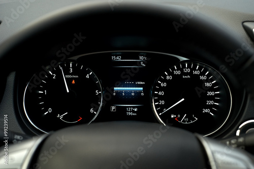 Modern car speedometer and illuminated dashboard