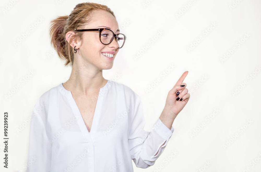 Young beautiful caucasian woman pointing to copy space, isolated on white background Young beautiful caucasian woman pointing to copy space, isolated on white background