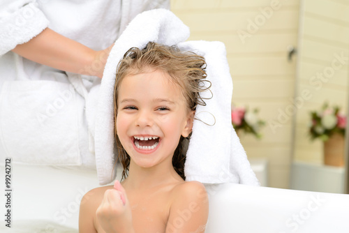 Mother and daughter taking bath 