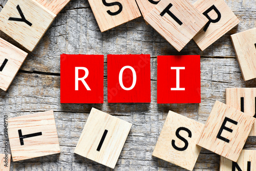 Red Wooden letters spelling ROI - return on investment
