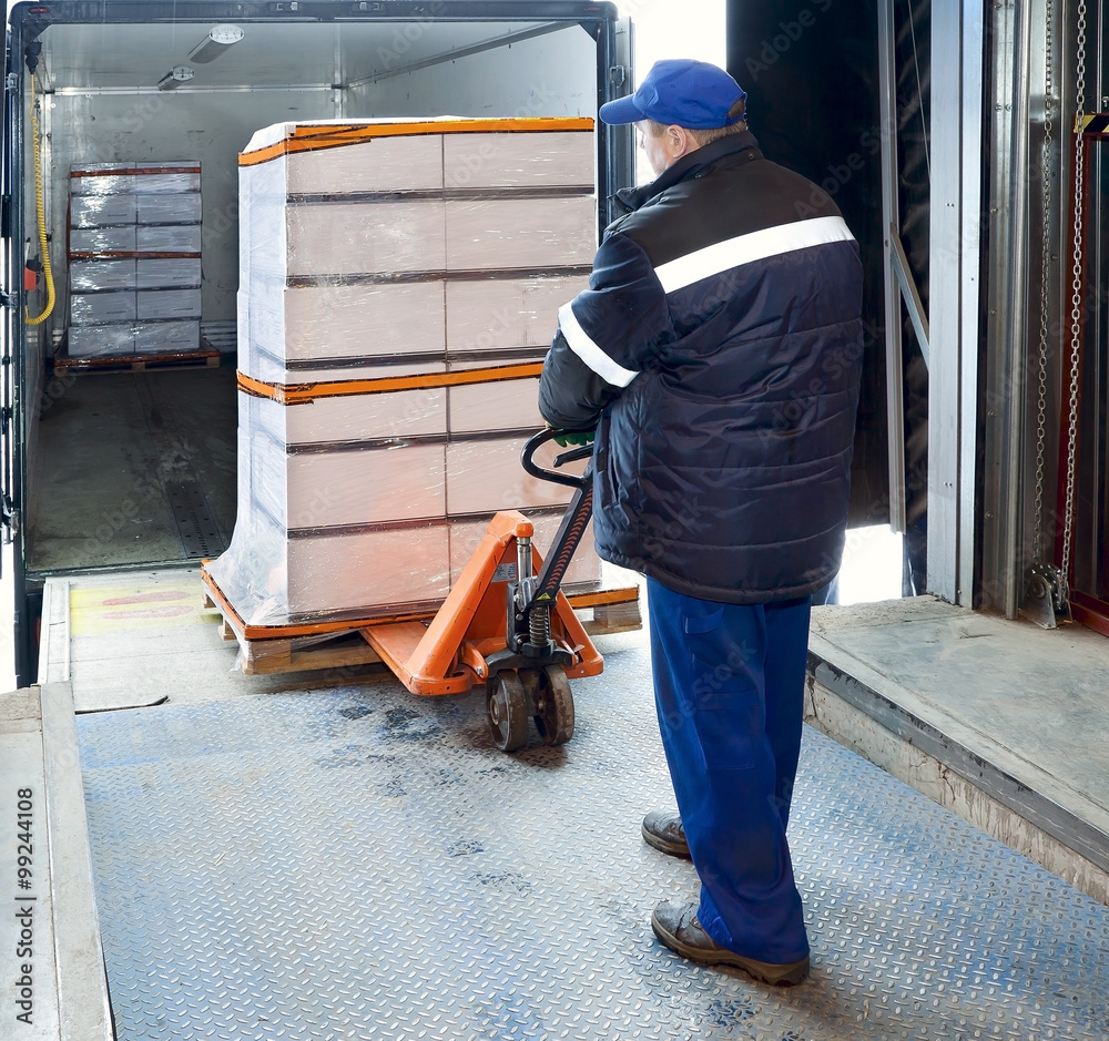 Fototapeta premium Worker loading on truck