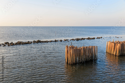 Bamboo Breakwater in the sea of  Bangkok Thailand photo