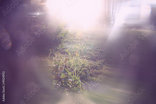 blurred abstract photo of light burst and glitter bokeh lights. filtered image and textured.  