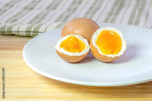 half medium-boiled eggs on white dish
