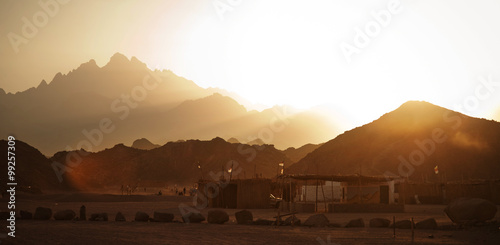 Beduin village in desert in mountains in sunset