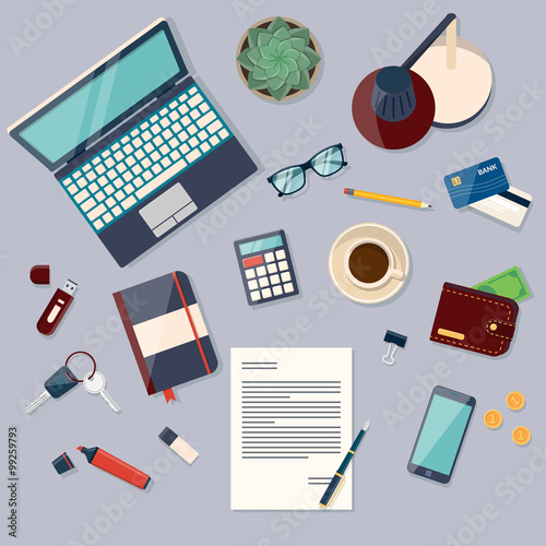 Top view of desk background with laptop, digital devices, office objects, books and documents