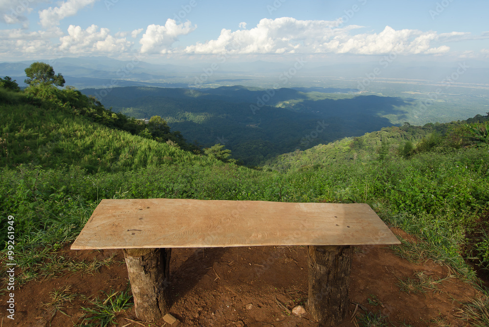 Lonely chair with grass, mountain and cloudy sky view of Chiangm