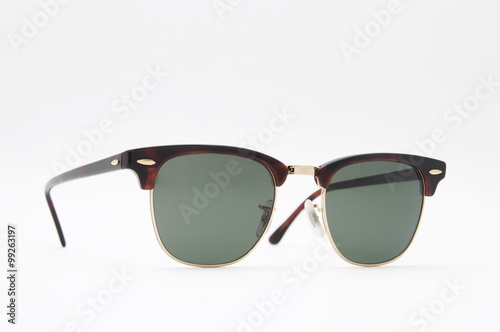 Retro brown sunglasses side view . Isolated on a white backgroun
