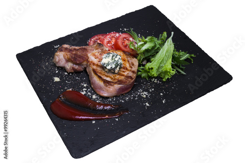 Grilled pork chop with vegetables, isolated on white