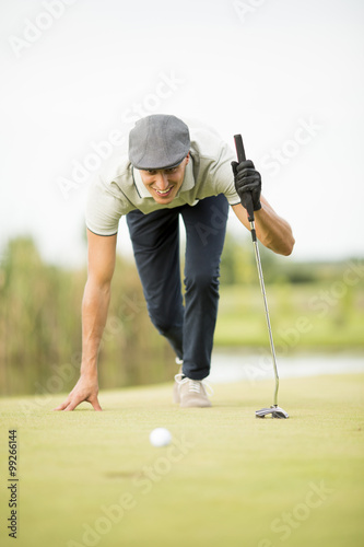 Young man playing golf