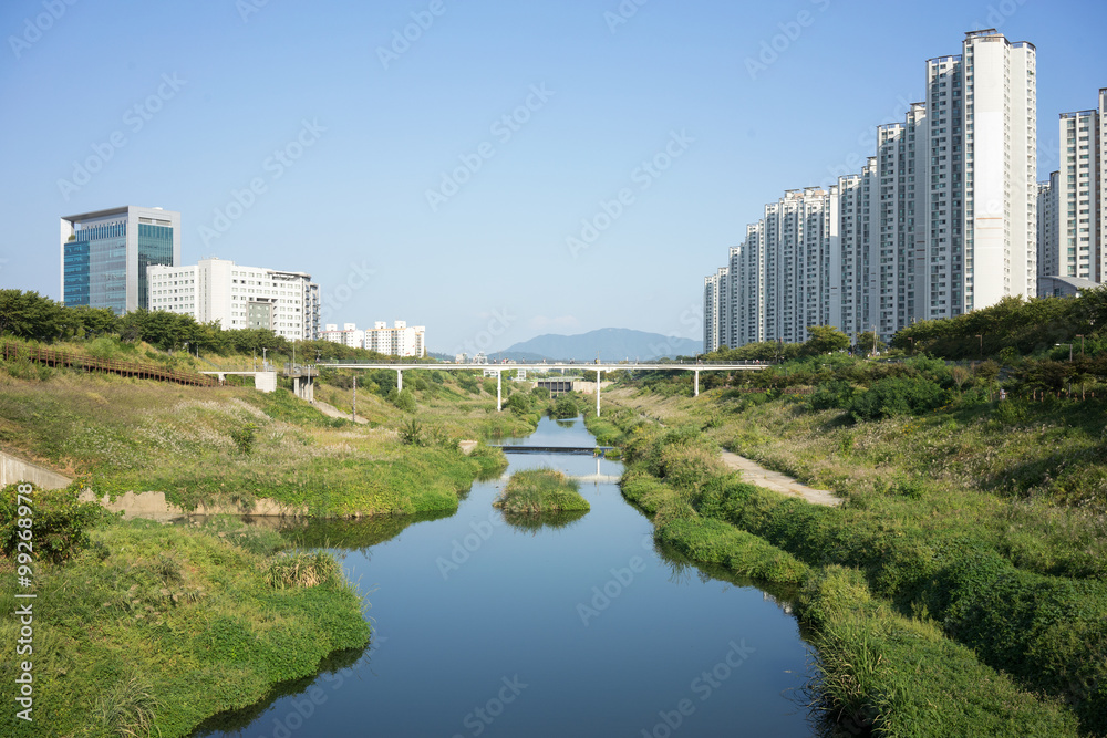 Apartment buildings with stream
