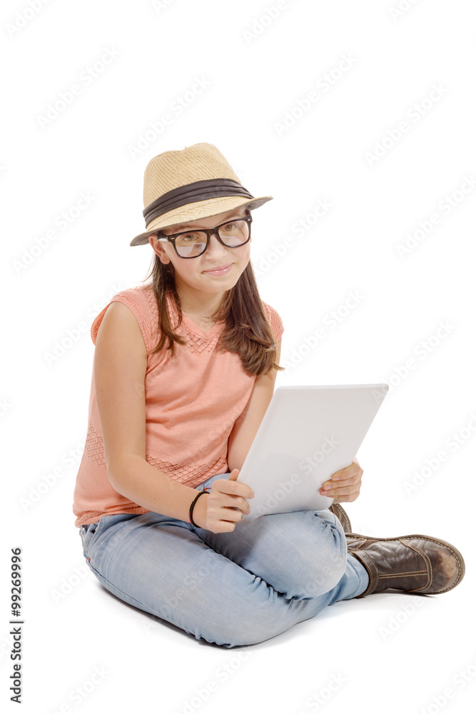 girl seating the floor with a tablet computer