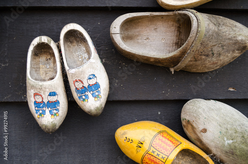 Dutch wooden shoes hanging on a wall as decoration.