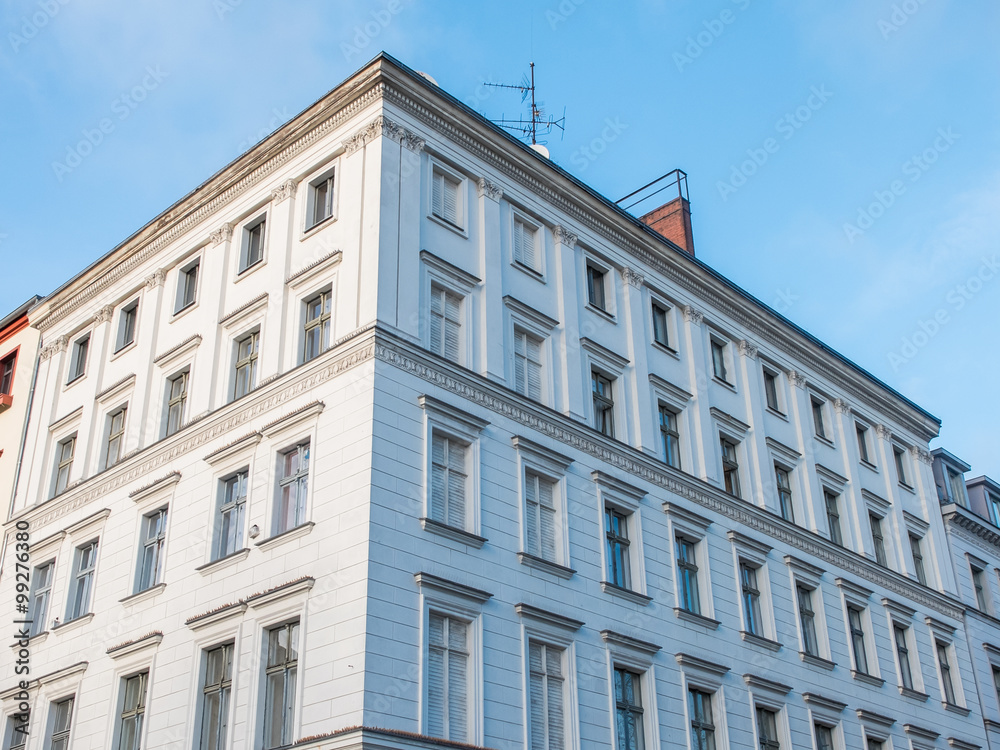 White Low Rise Building in Warm Sunlight