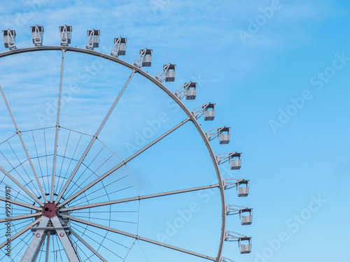 Ferris wheel with passenger gondolas