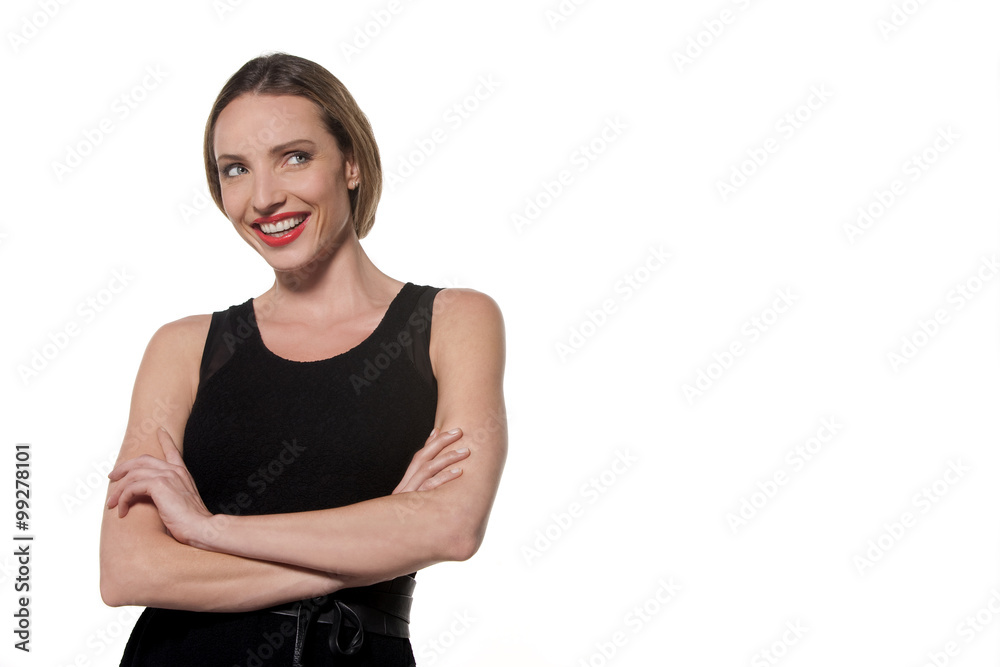 Simple woman with arms crossed wearing an elegant black sleeveless dress - isolated Simple woman with arms crossed wearing an elegant black sleeveless dress - isolated