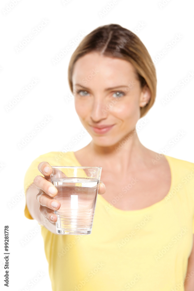 Portrait of a happy woman holding a glass of fresh water Portrait of a happy woman holding a glass of fresh water