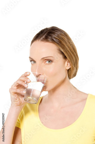 Woman holding a glass of fresh water