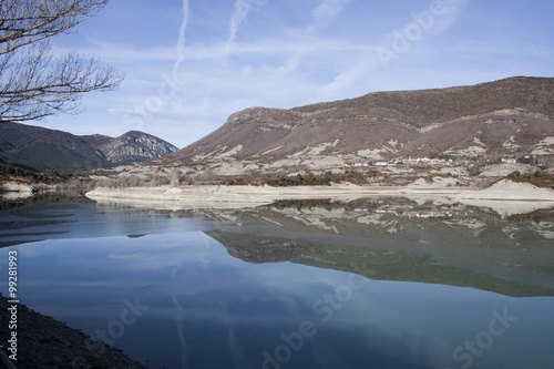 Reflection of the mountain in the reservoir of Arguis, Huesca photo