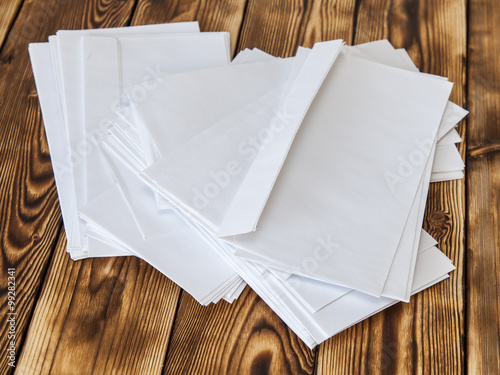 Rough pile of white post envelopes