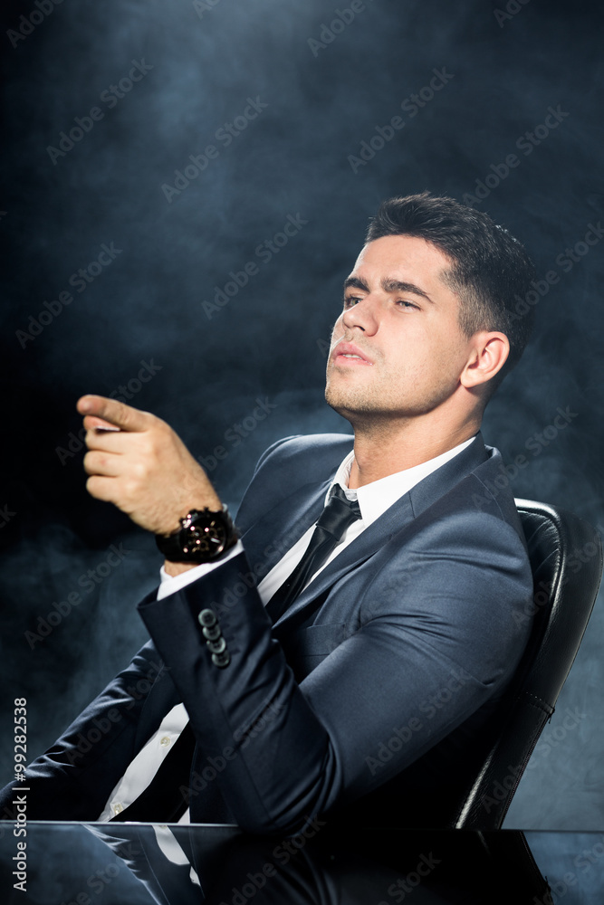 Arrogant boss sitting on chair Arrogant boss sitting on chair