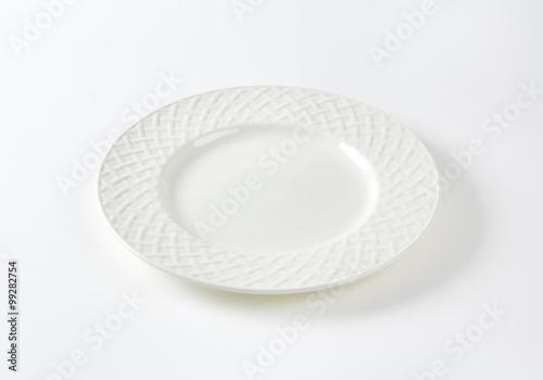 White porcelain plate with decorative rim