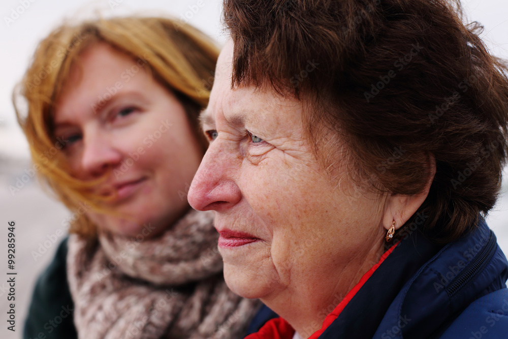 Portrait of beautiful senior woman and her adult daughter Portrait of beautiful senior woman and her adult daughter