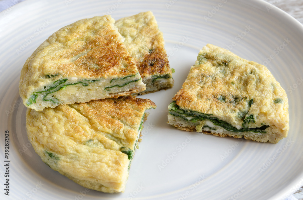 Omelet with spinach on plate Omelet with spinach on plate