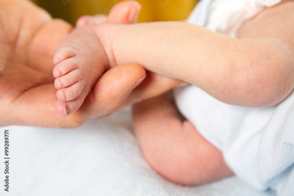 Doctor massaging little baby's foot Doctor massaging little baby's foot