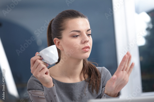 girl looking at her nails