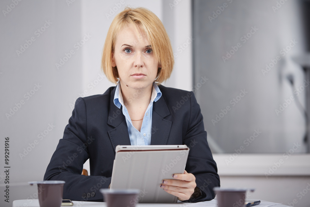 business woman with a tablet in the office business woman with a tablet in the office