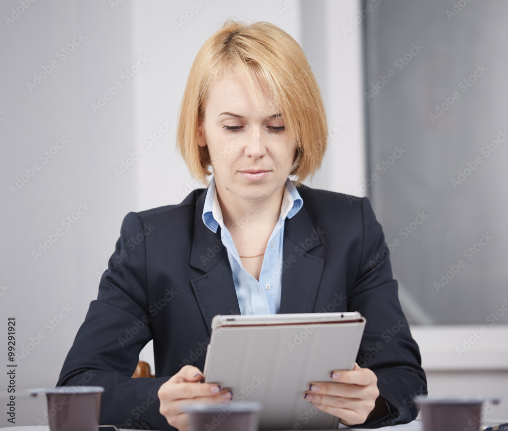 business woman with a tablet in the office business woman with a tablet in the office