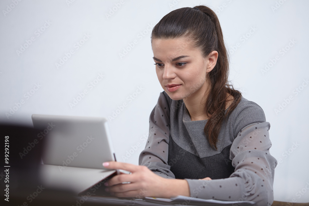 business woman with a tablet in the office business woman with a tablet in the office