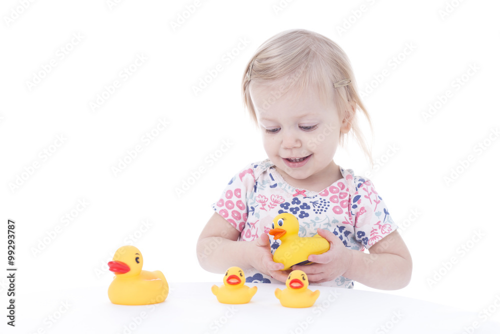 toddler girl playing with ducks toddler girl playing with ducks
