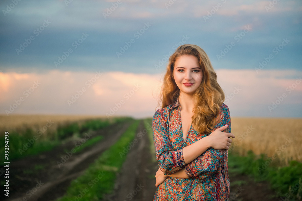 Young Slavic girl standing in field Young Slavic girl standing in field