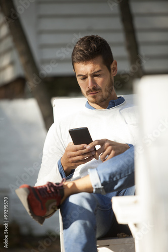 Young Handsome Man Using Mobile Phone Outdoor