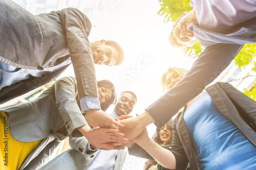 Photography Group of business people with hands on stack