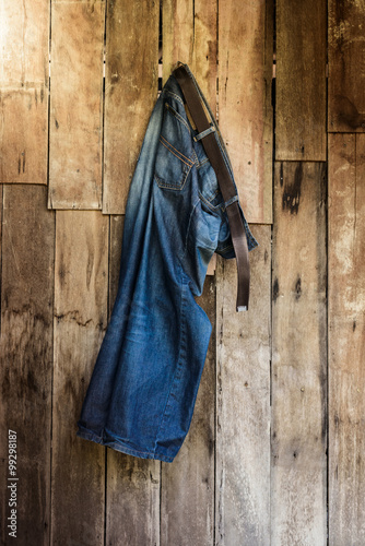 Vintage,Jeans hanging on the wall photo